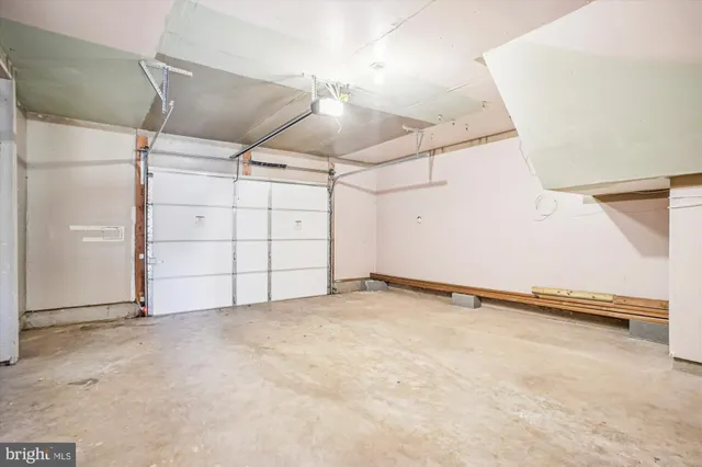 a view of a porch with wooden floor and fence