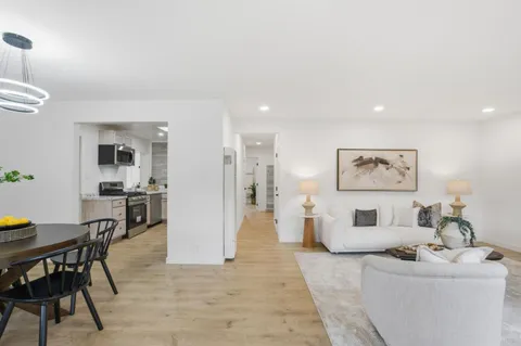 a kitchen with a stove a sink and a microwave
