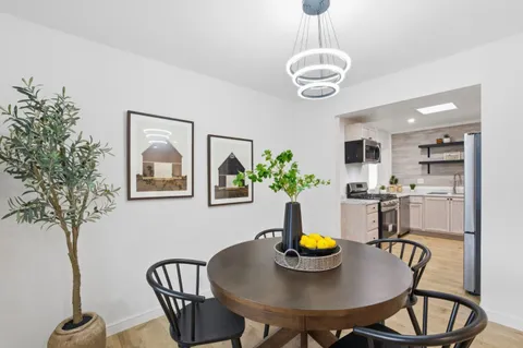 a kitchen with a sink stove and refrigerator