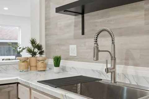 a bedroom with a bed and a lamp