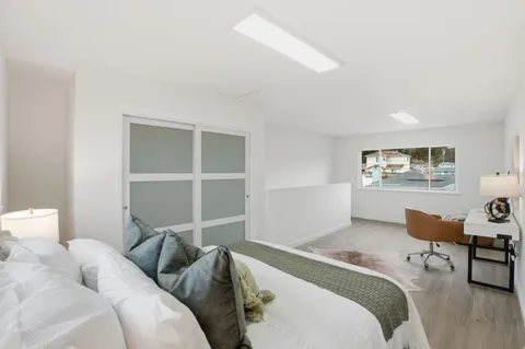 a bathroom with a sink vanity and mirror