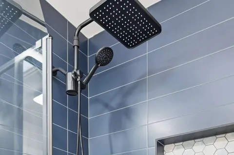 a patio with table and chairs and potted plants