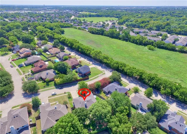 an aerial view of house with yard