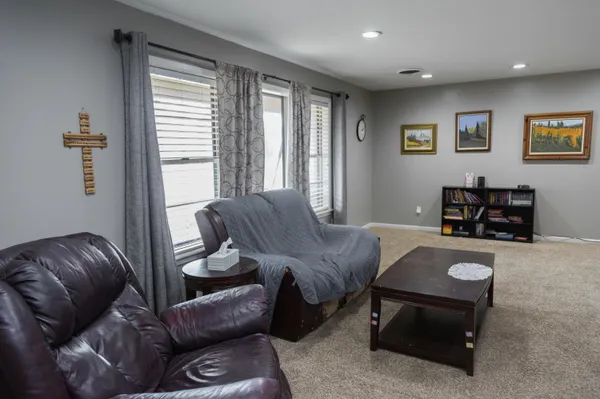 a living room with furniture and a window