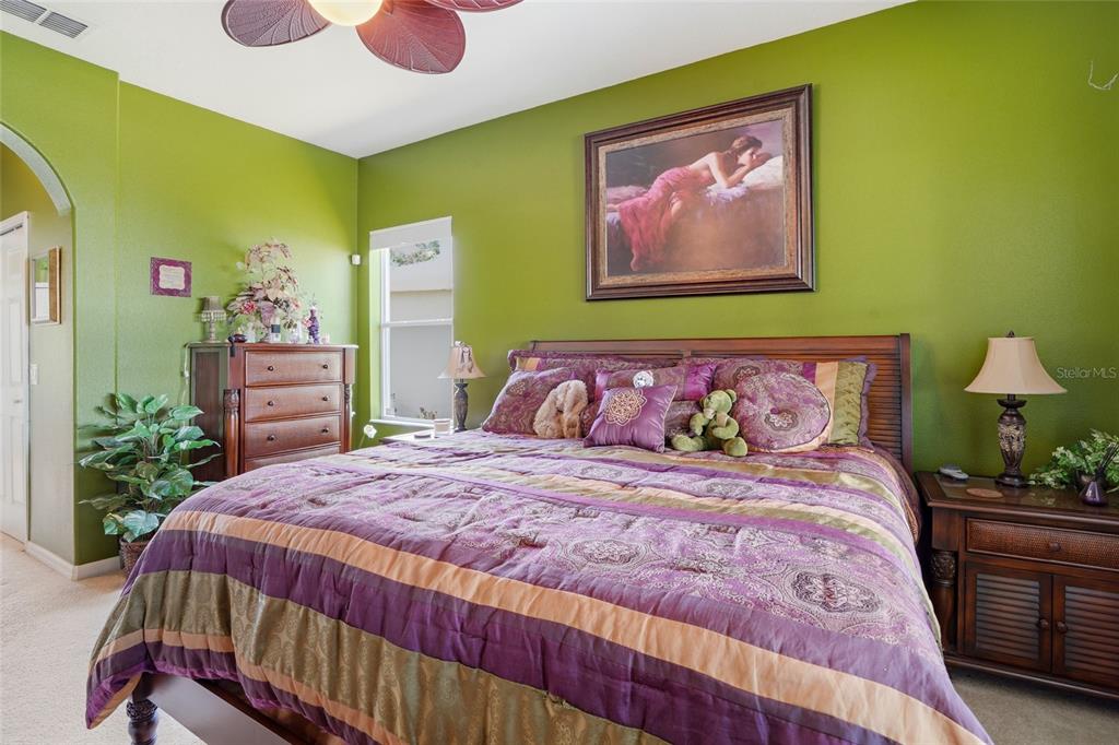 4154 Braemere Drive Spring Hill, FL 34609 - Photo 11 of 95 a bedroom with a bed and a view of kitchen