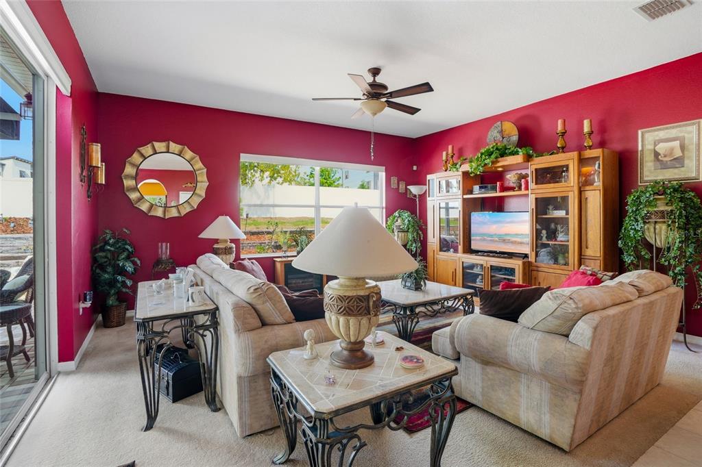 4154 Braemere Drive Spring Hill, FL 34609 - Photo 17 of 95 a living room with furniture and a large window