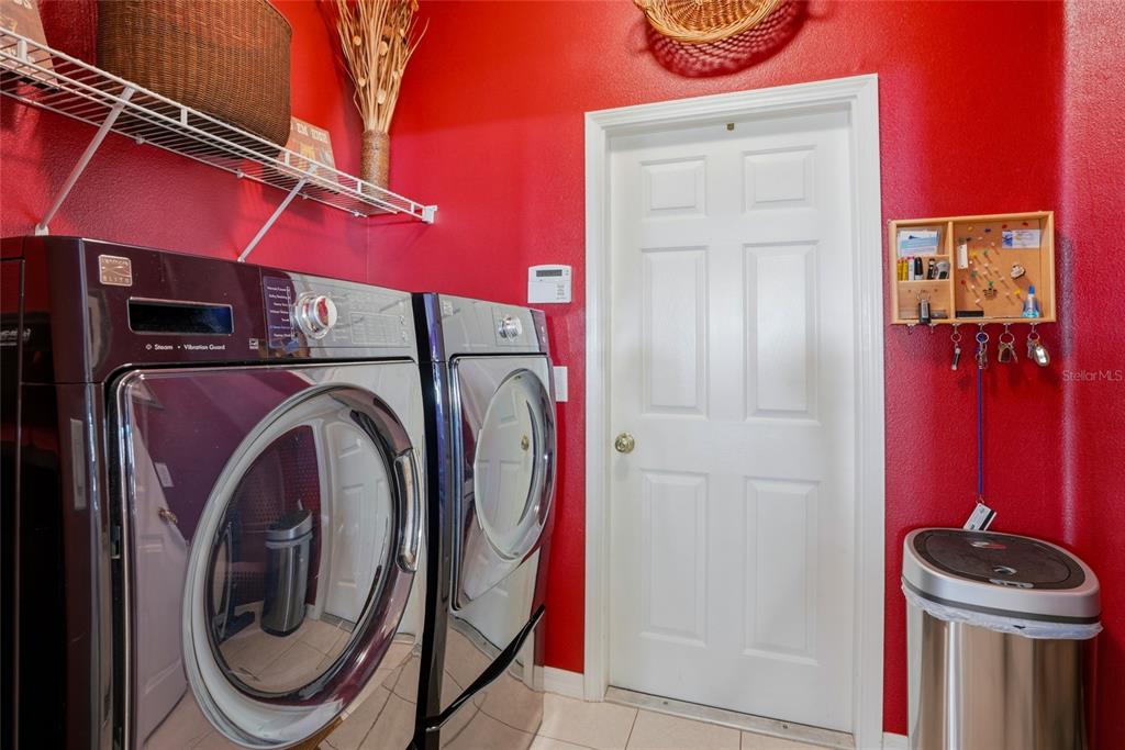 4154 Braemere Drive Spring Hill, FL 34609 - Photo 23 of 95 a utility room with dryer and washer