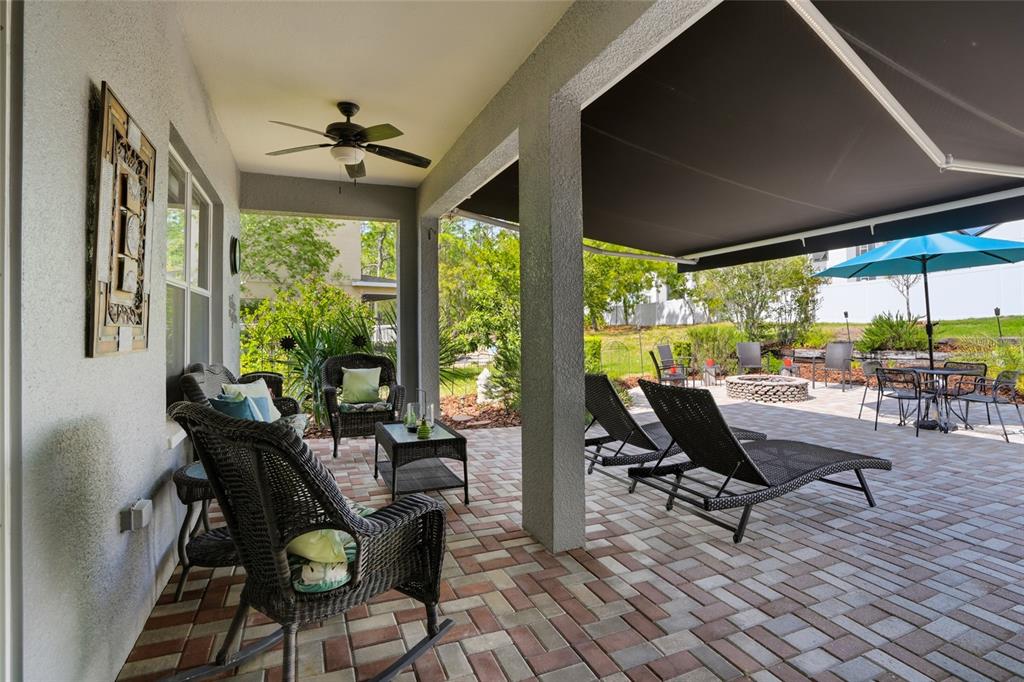 4154 Braemere Drive Spring Hill, FL 34609 - Photo 27 of 95 a view of a dining room with furniture wooden floor and balcony