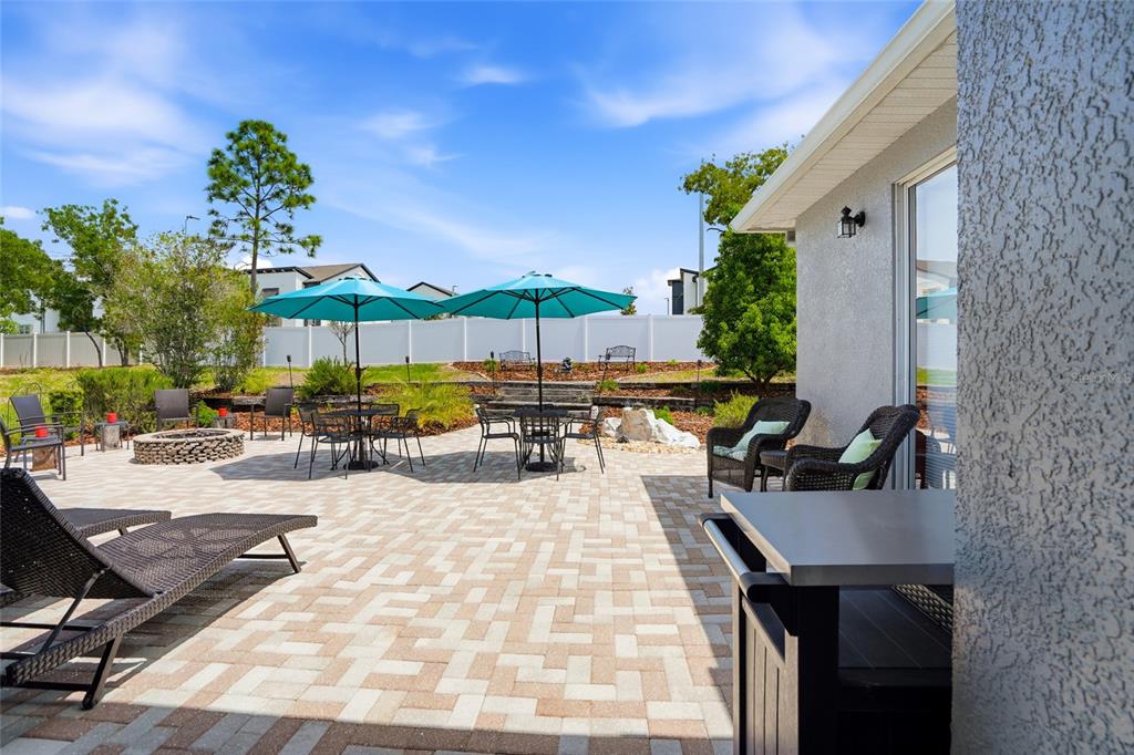 4154 Braemere Drive Spring Hill, FL 34609 - Photo 32 of 95 a view of a patio with a table and chairs