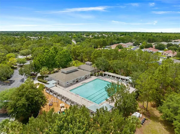 a view of residential houses with outdoor space and swimming pool