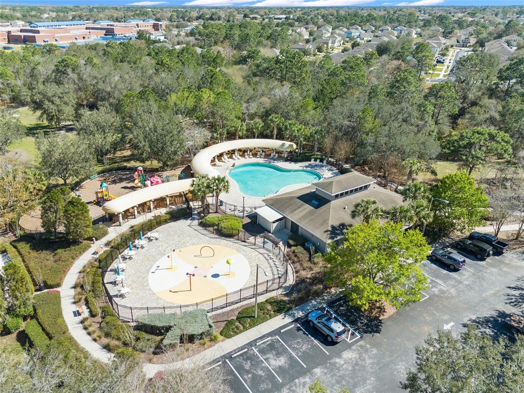 4154 Braemere Drive Spring Hill, FL 34609 - Photo 55 of 95 an aerial view of a swimming pool with a yard and outdoor seating