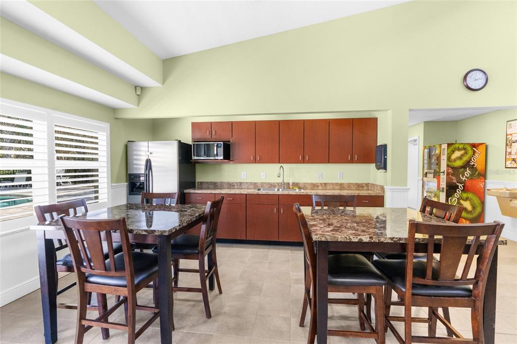 4154 Braemere Drive Spring Hill, FL 34609 - Photo 71 of 95 a dining room with a wooden table and chairs
