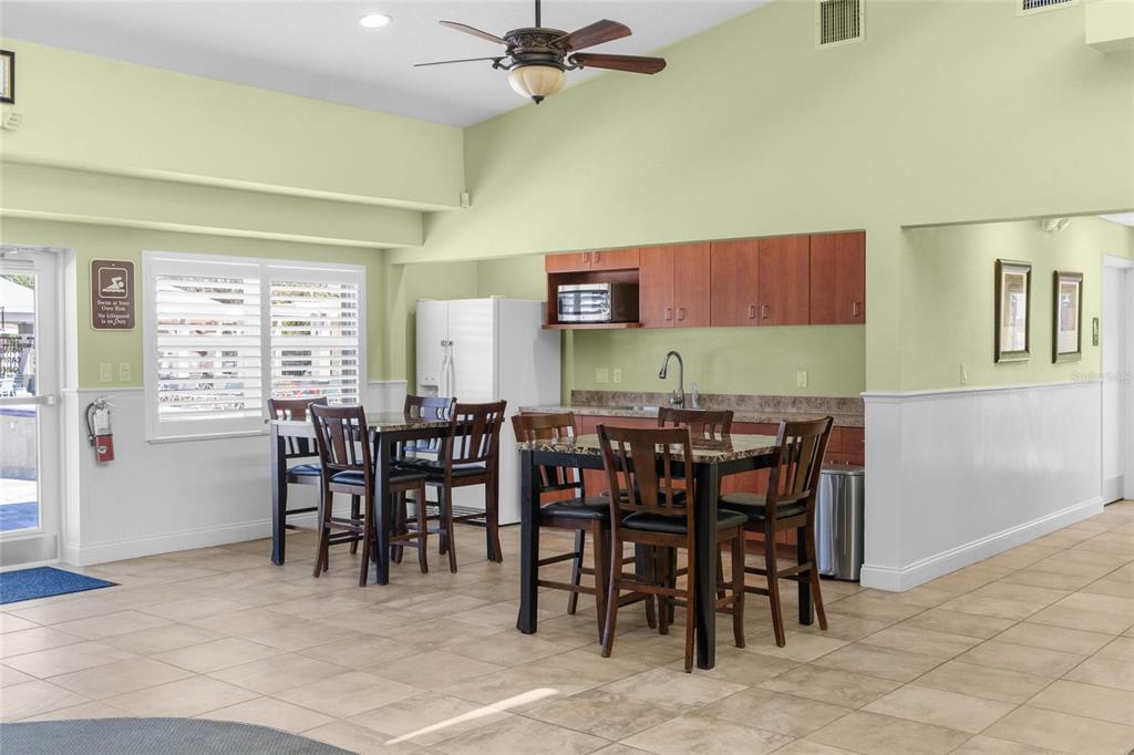 4154 Braemere Drive Spring Hill, FL 34609 - Photo 74 of 95 a view of a dining room with furniture and a window