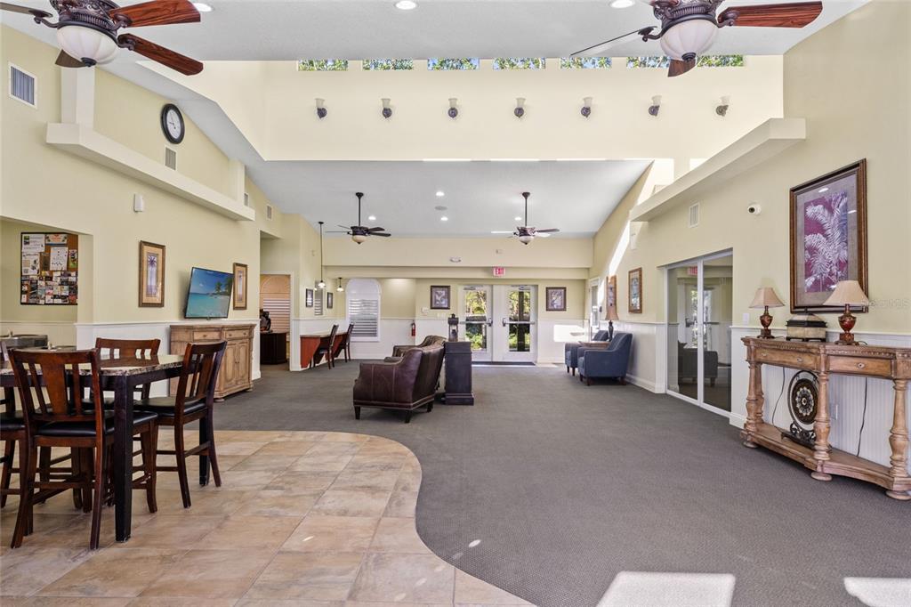 4154 Braemere Drive Spring Hill, FL 34609 - Photo 75 of 95 a living room with furniture and a chandelier