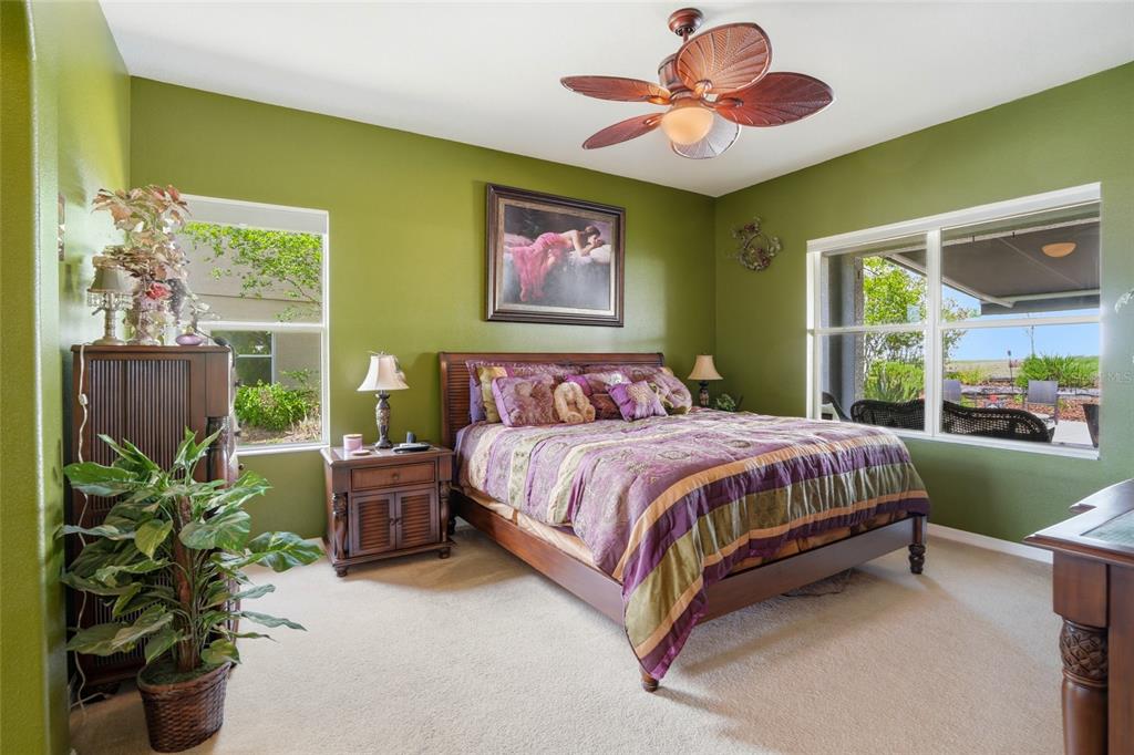4154 Braemere Drive Spring Hill, FL 34609 - Photo 10 of 95 a spacious bedroom with a bed and a window