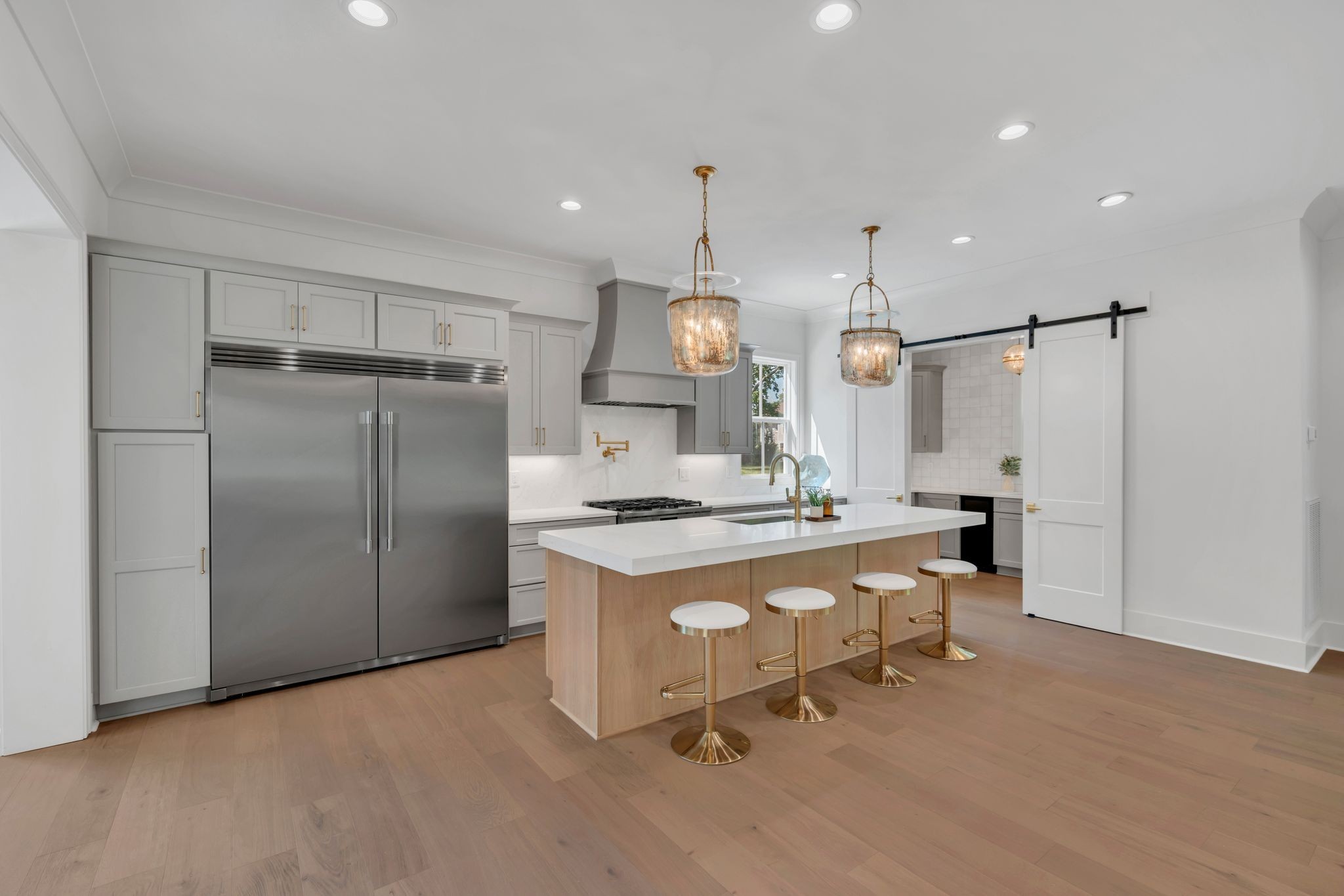 5441 Wakefield Drive Nashville, TN 37220 - Photo 18 of 72 a kitchen with stainless steel appliances granite countertop a stove a refrigerator and a refrigerator with wooden floor