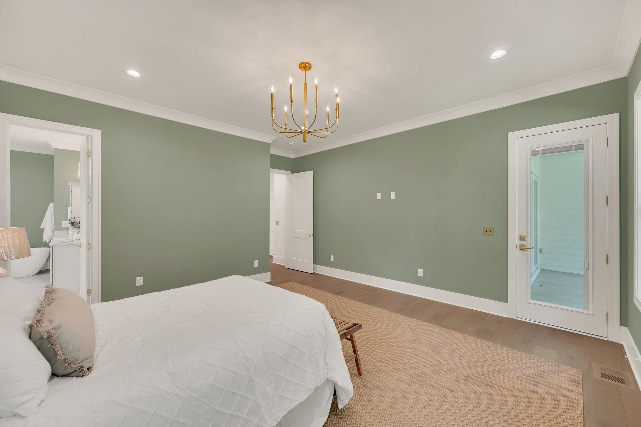 5441 Wakefield Drive Nashville, TN 37220 - Photo 32 of 72 a bedroom with a large bed and chandelier