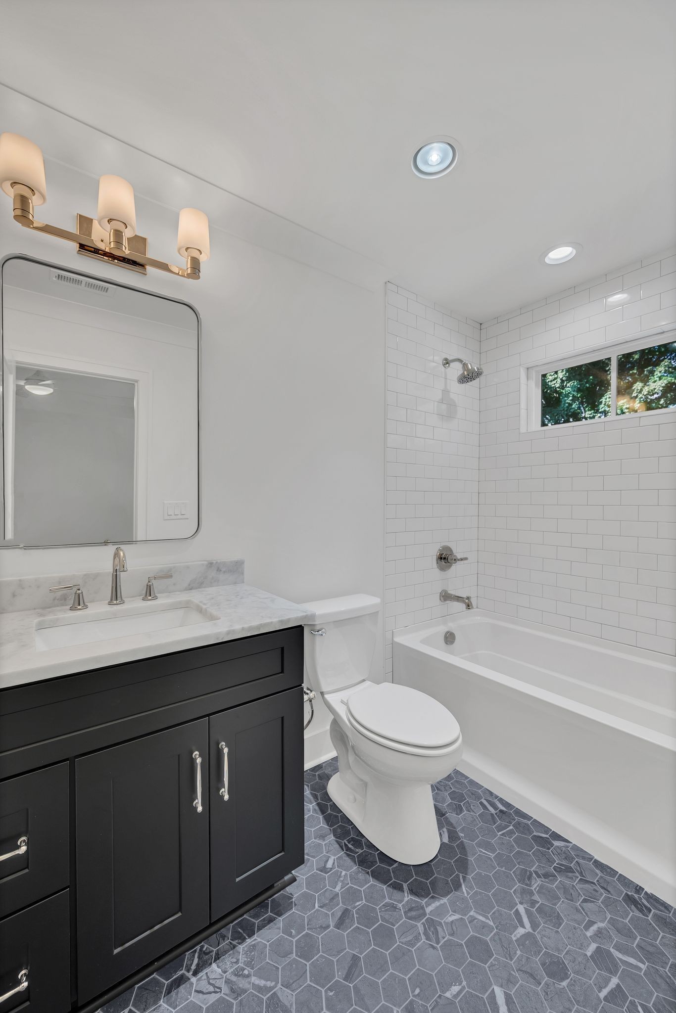 5441 Wakefield Drive Nashville, TN 37220 - Photo 47 of 72 a bathroom with a toilet a sink a mirror and bathtub