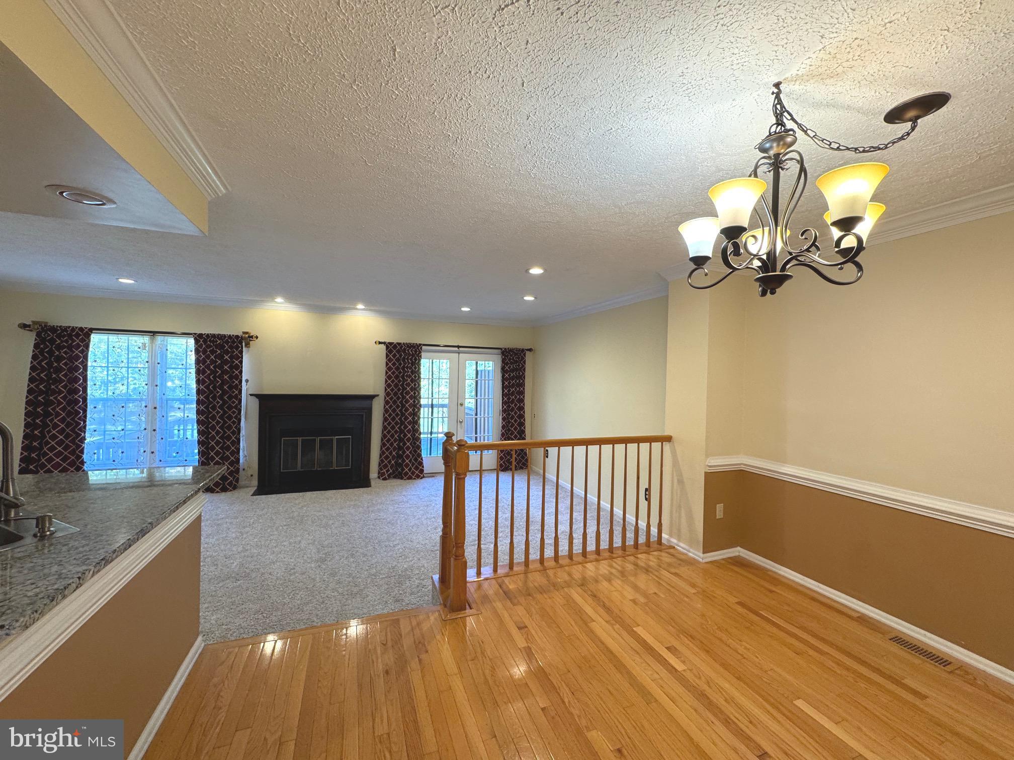 36 Castleton Road Princeton, NJ 08540 - Photo 4 of 5 a view of a livingroom with fireplace and wooden floor