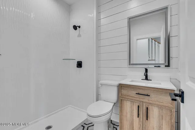 a bathroom with a sink toilet and vanity