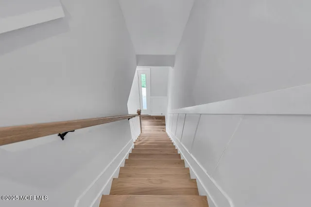 a view of a hallway with stairs