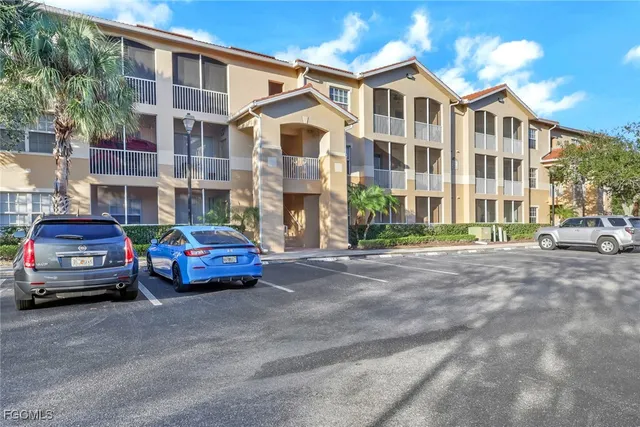a car parked in front of a white building