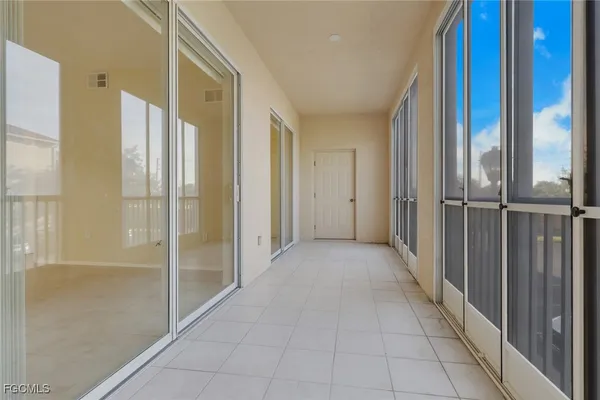 a view of a hallway with a glass door