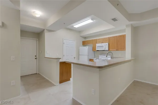 a kitchen with stainless steel appliances granite countertop a sink and cabinets