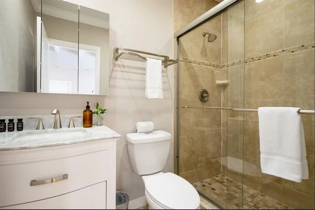 a living room with furniture and large windows