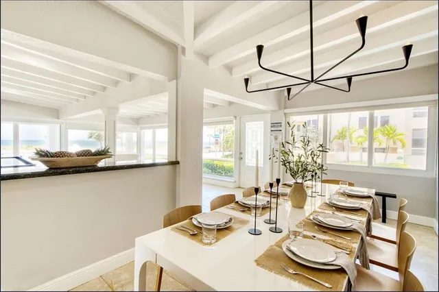 a bedroom with two beds and a large window