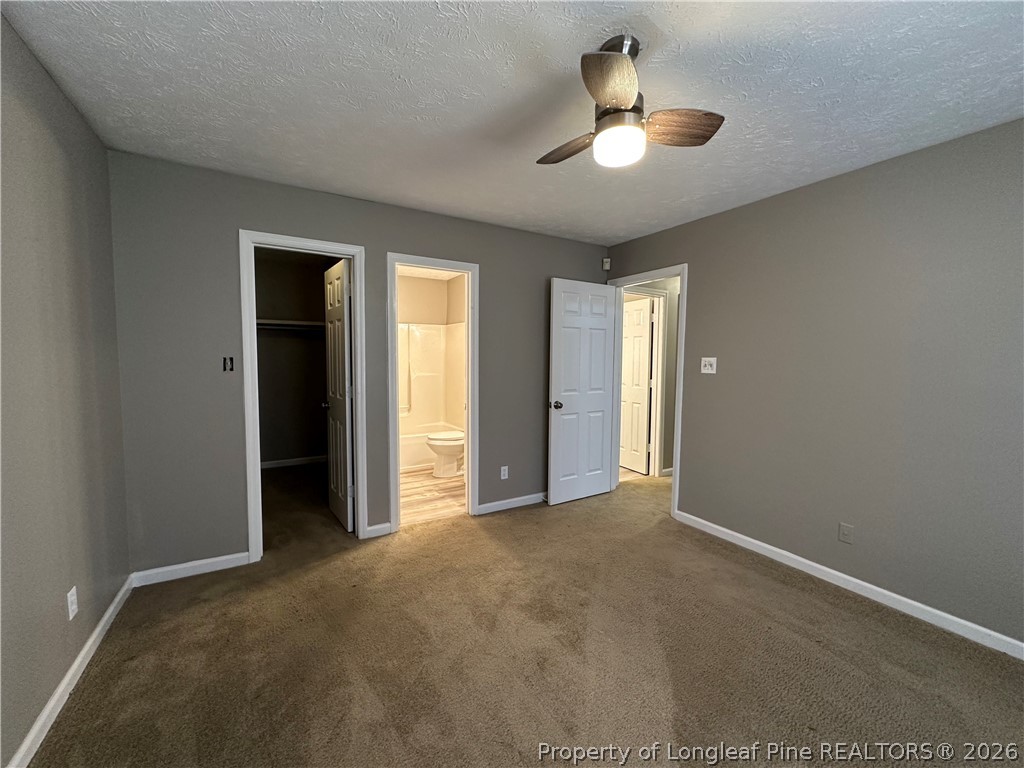 2678 Rivercliff Road Fayetteville, NC 28301 - Photo 14 of 19 an empty room with ceiling fan and window