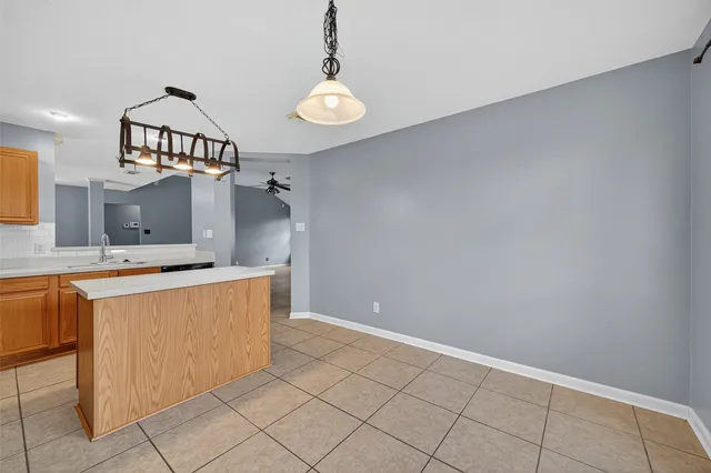 a view of a room with wooden cabinets