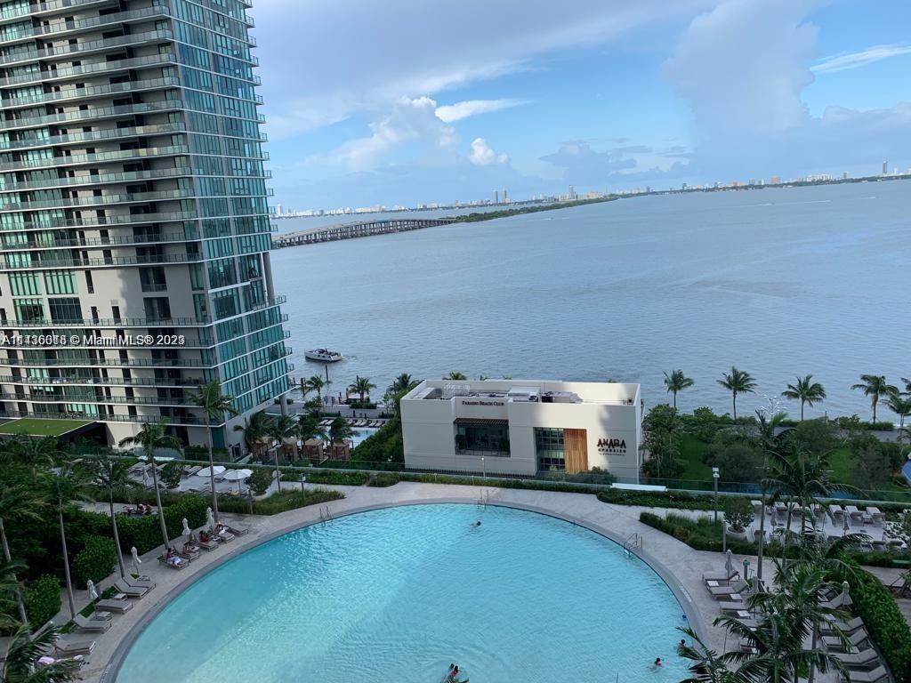 Paraiso Bay Miami, FL 33137 - Photo 2 of 9 a balcony with a table and chairs