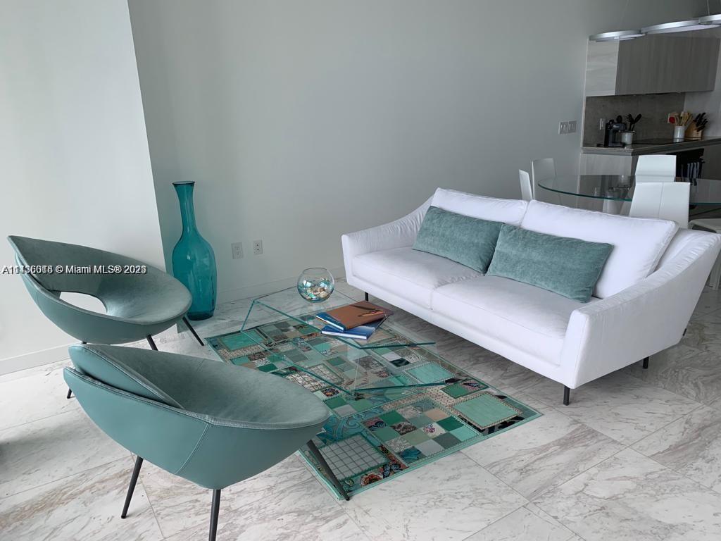 Paraiso Bay Miami, FL 33137 - Photo 4 of 9 a living room with furniture and a rug