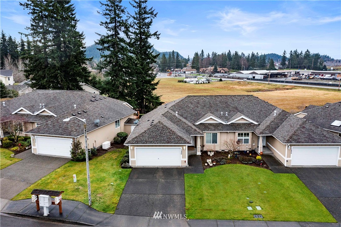 1488 Mountain View Drive, Unit 4 Enumclaw, WA 98022 - Photo 2 of 20 a view of a house with swimming pool and sitting area