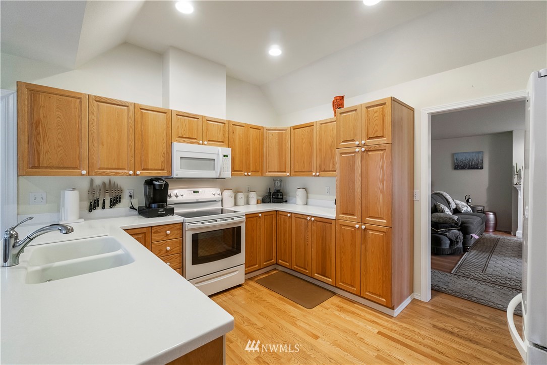 1488 Mountain View Drive, Unit 4 Enumclaw, WA 98022 - Photo 7 of 20 a kitchen that has a sink cabinets counter space and appliances