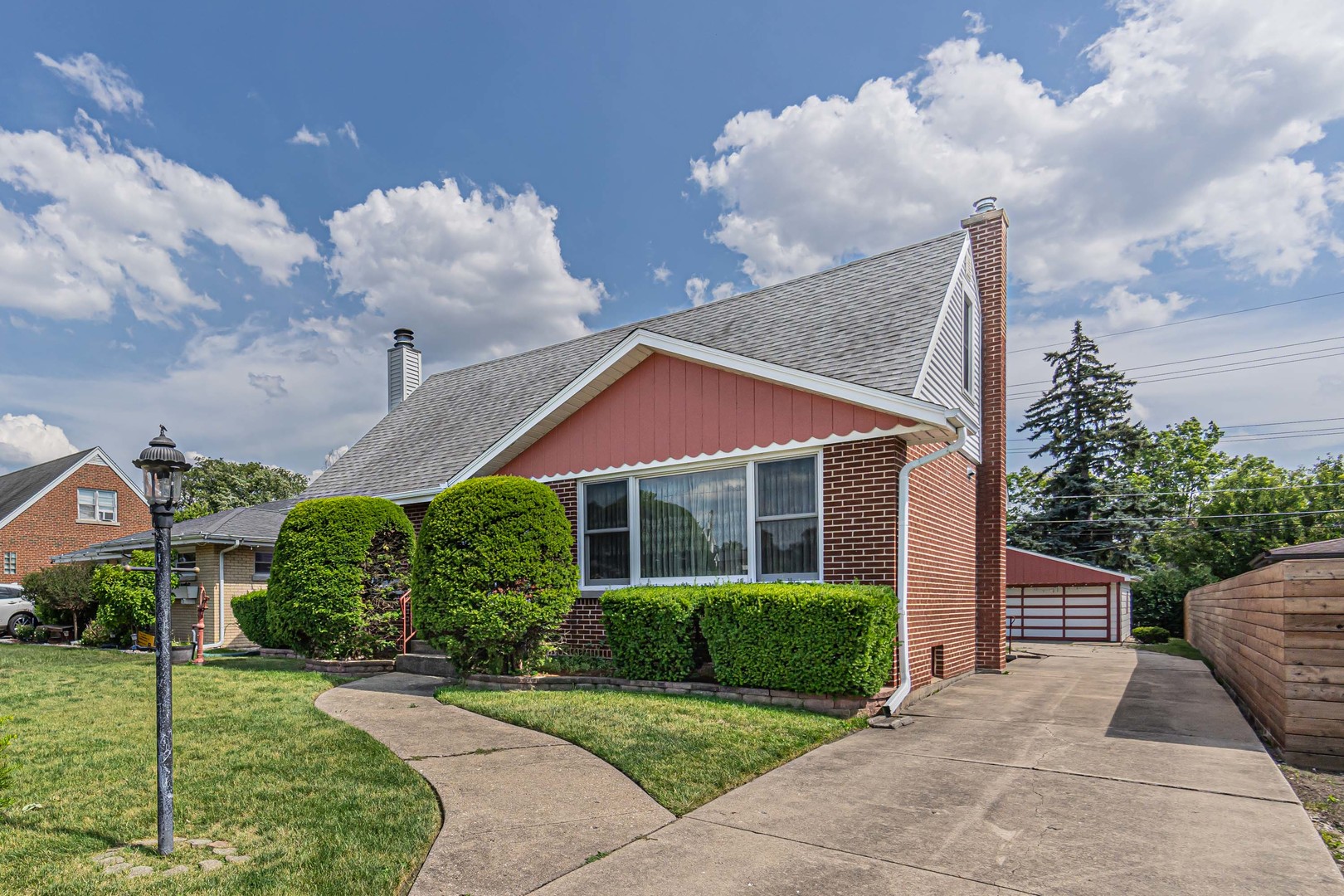 1001 Oakton Street Park Ridge, IL 60068 - Photo 1 of 33 a view of a house with a yard and plants