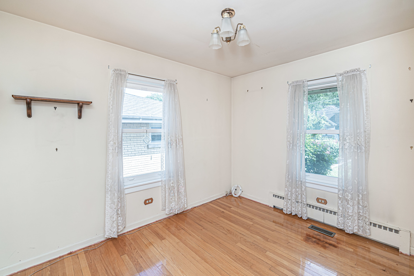 1001 Oakton Street Park Ridge, IL 60068 - Photo 12 of 33 a view of a room with wooden floor and windows