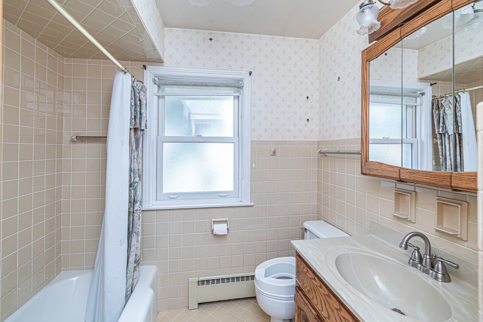 1001 Oakton Street Park Ridge, IL 60068 - Photo 13 of 33 a bathroom with a sink toilet and shower