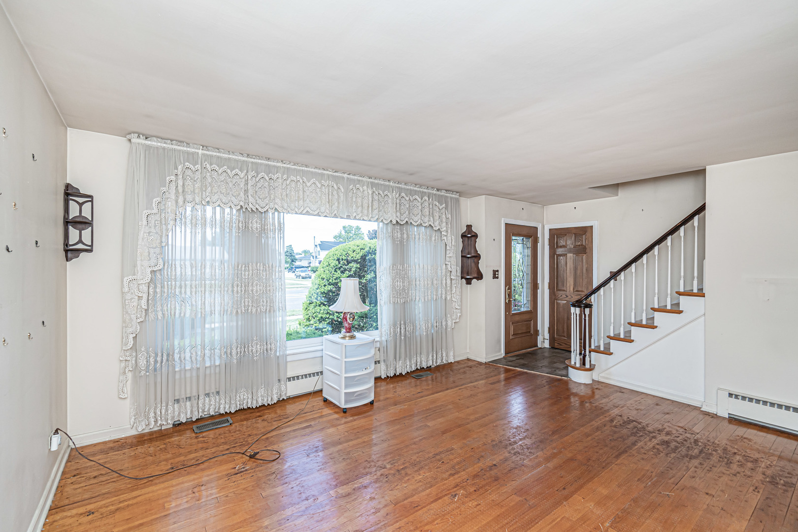 1001 Oakton Street Park Ridge, IL 60068 - Photo 2 of 33 a view of an empty room with wooden floor and a window