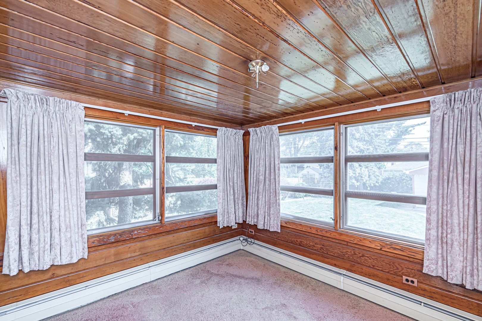 1001 Oakton Street Park Ridge, IL 60068 - Photo 9 of 33 a view of empty room with wooden floor and windows