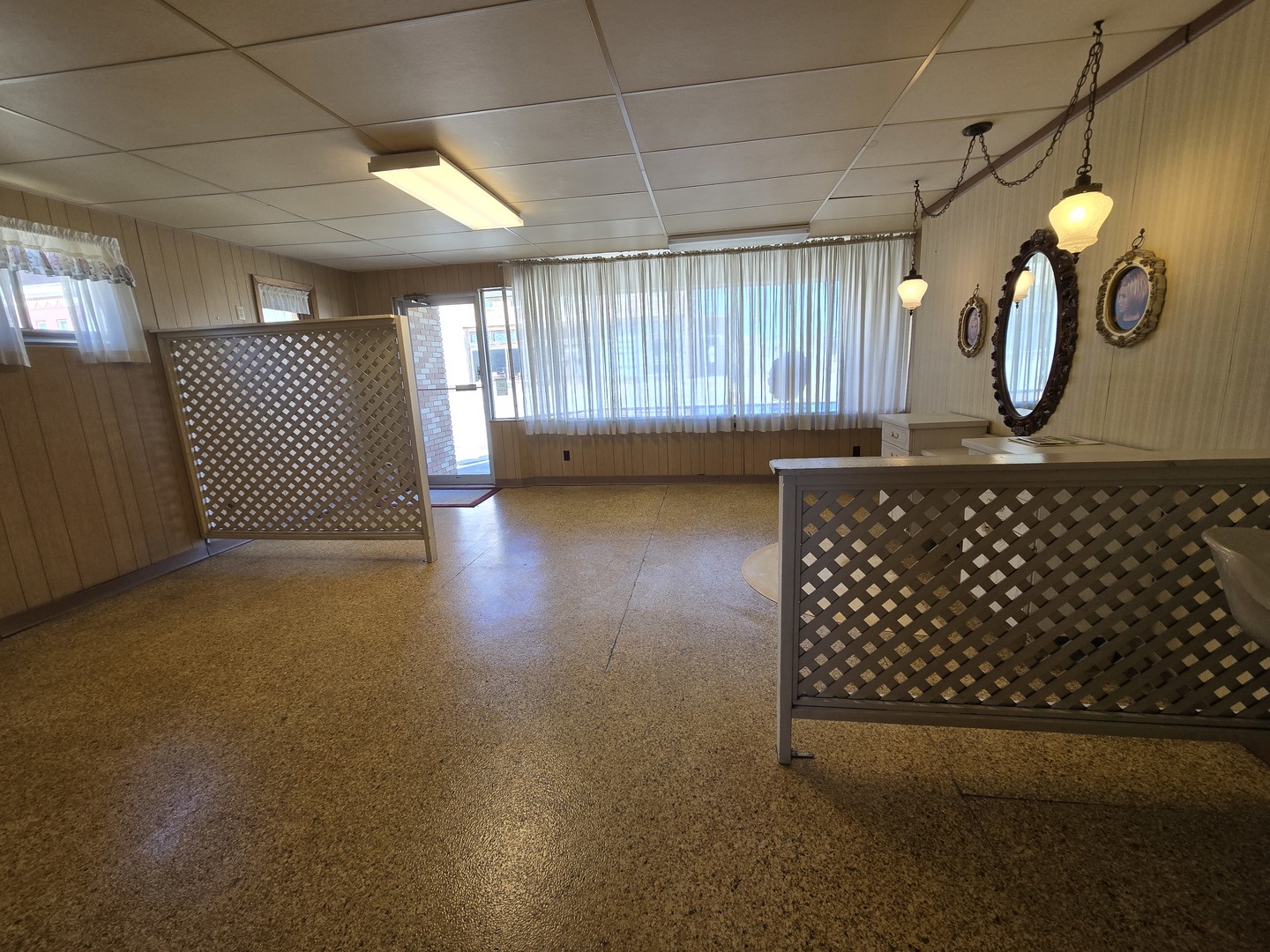 115 East Mason Street Polo, IL 61064 - Photo 4 of 6 a view of a livingroom with wooden floor and a window