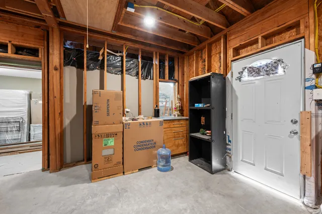 a view of an empty room with closet