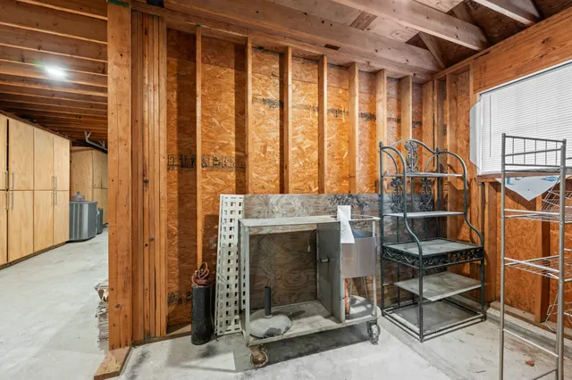 a view of an entryway with wooden floor and door