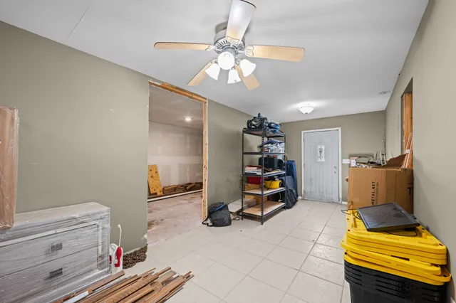 a view of a room with workspace and a window