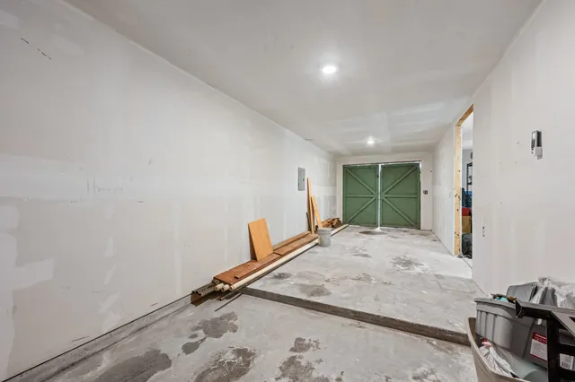 a view of a livingroom with furniture and workspace