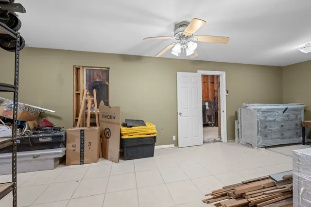 a view of a kitchen with a sink and cabinets