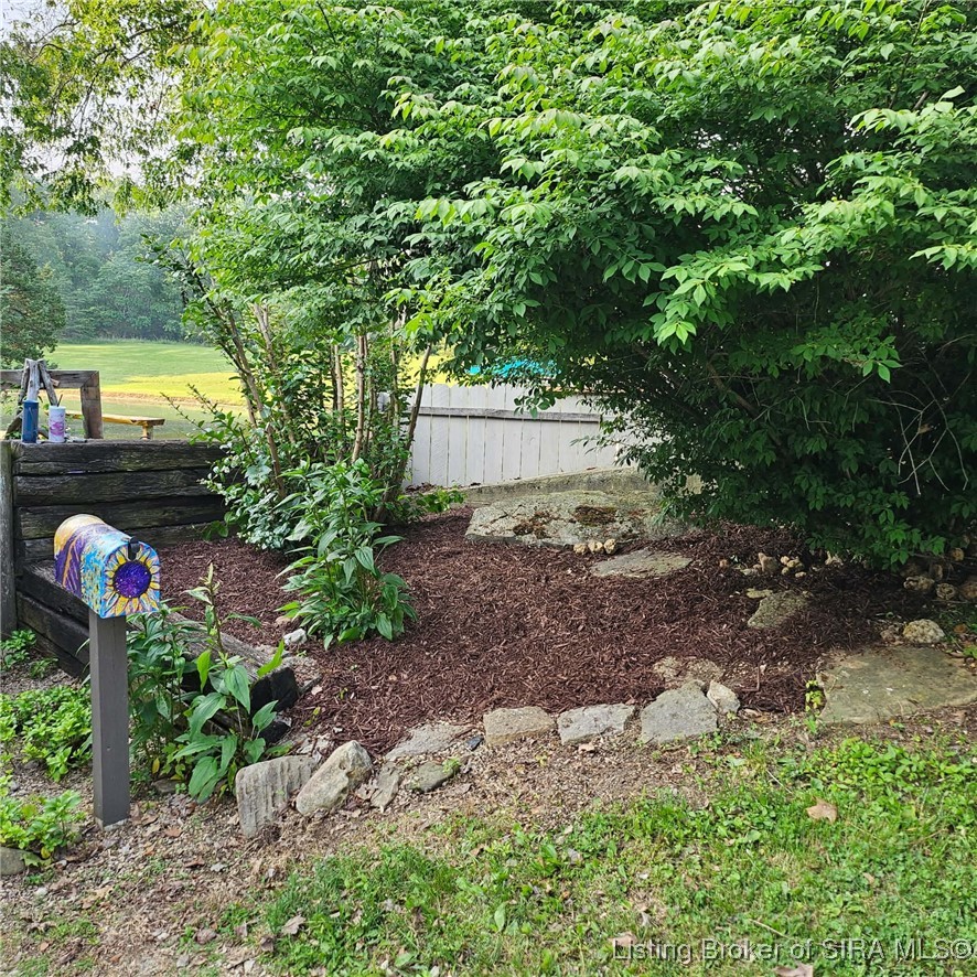 12906 West Polk Road Lexington, IN 47138 - Photo 5 of 49 Beautiful perineal landscaping (Spring)