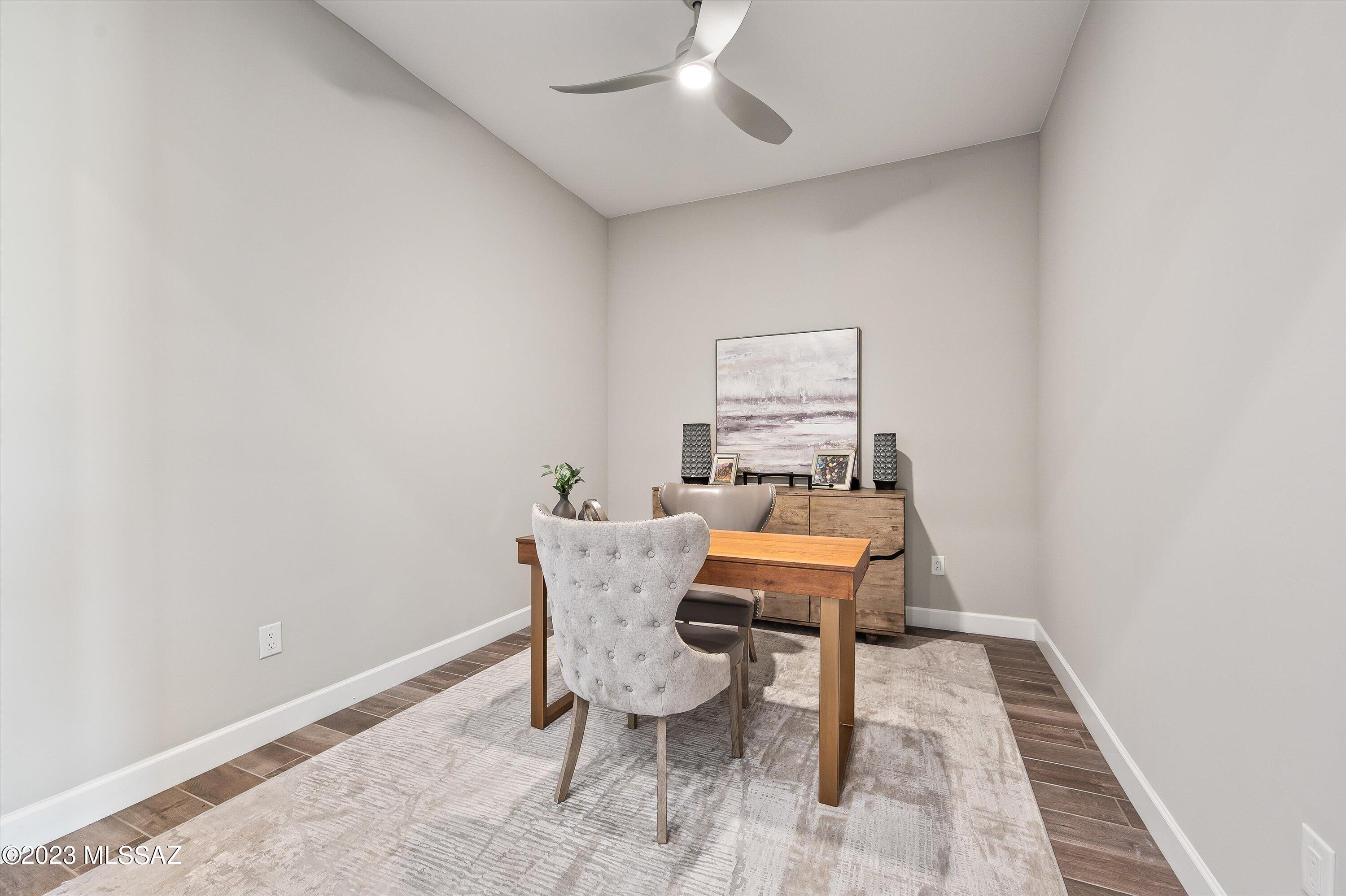 13169 North Vistoso Rnch Place Oro Valley, AZ 85755 - Photo 4 of 29 a dining room with furniture and wooden floor
