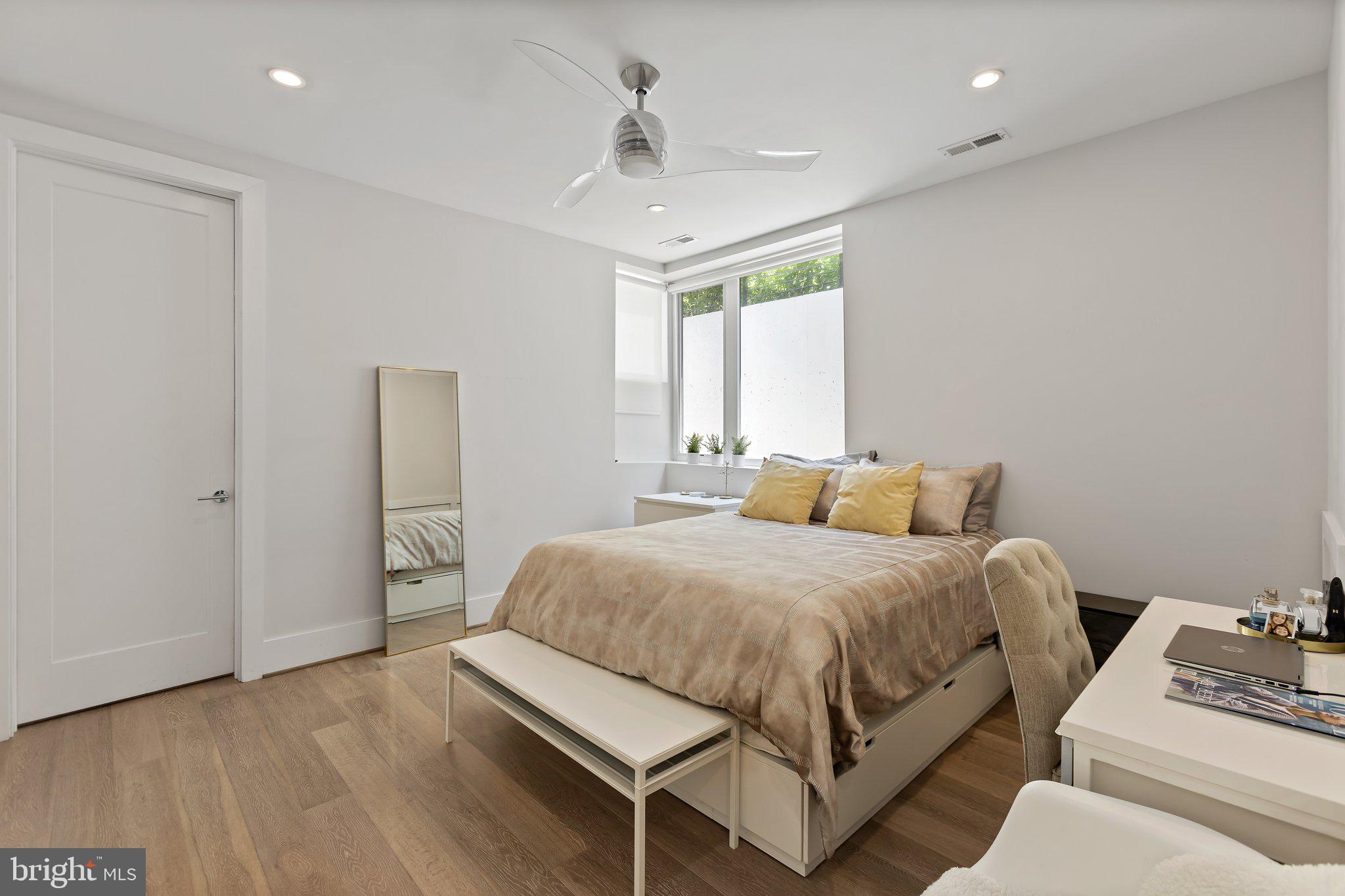3919 Fulton Street Northwest, Unit 4 Washington, DC 20007 - Photo 17 of 31 a bedroom with a bed and a window